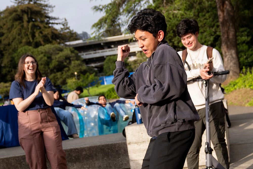 Attendees look on as a person breaks out in dance. (Photo by Adam Lau / Berkeley Engineering)
