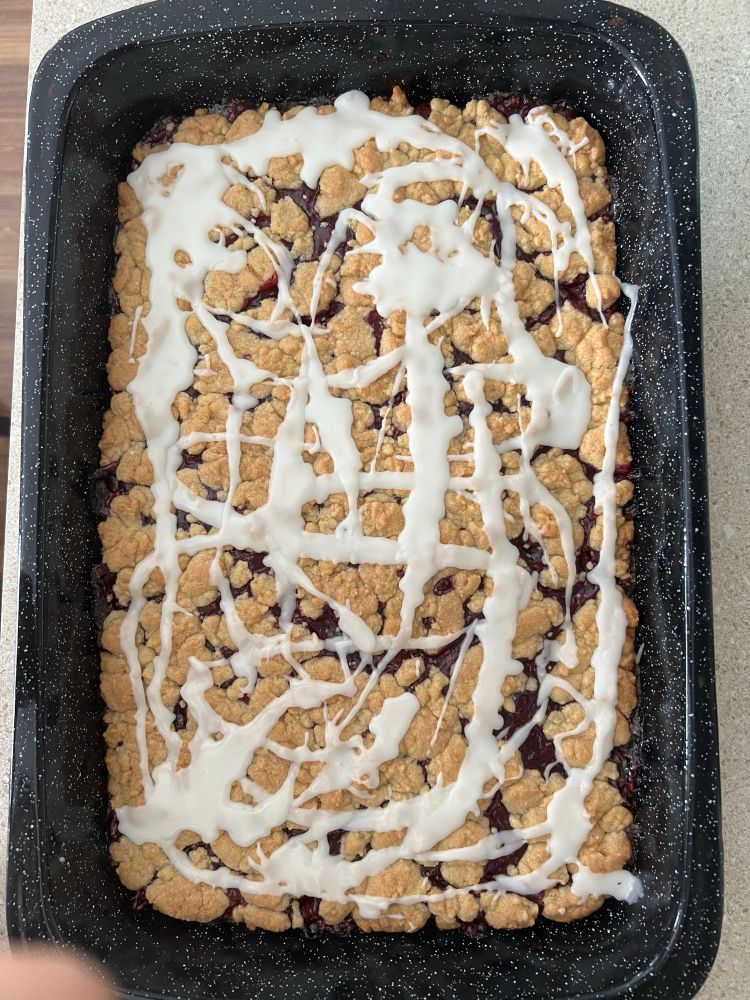 Raspberry squares with lemon icing still warm in the pan 