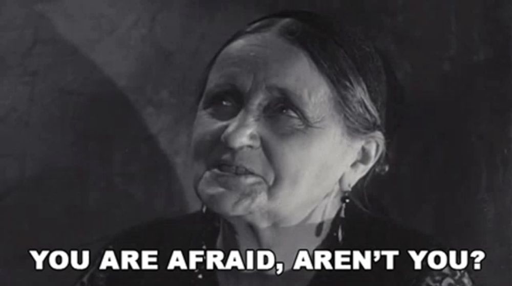 a black and white photo of an elderly woman saying you are afraid aren 't you