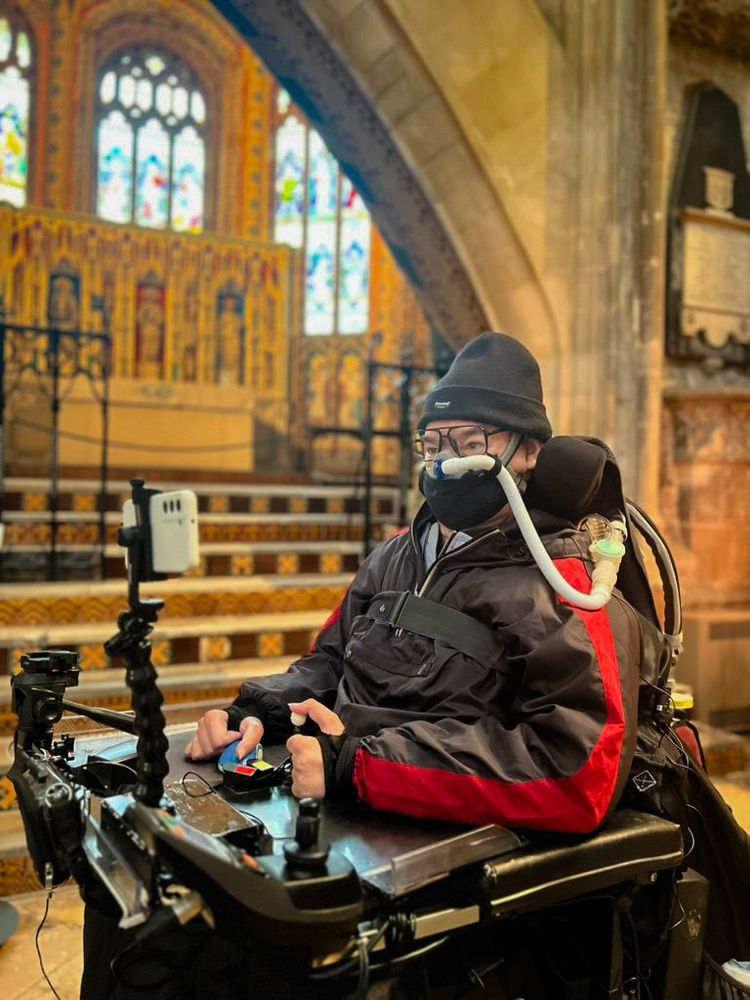 Daniel Baker in his wheelchair at Gloucester Cathedral 