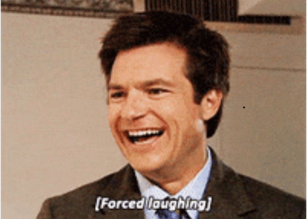Picture of Jason Bateman with the caption ‘Forced Laughter’