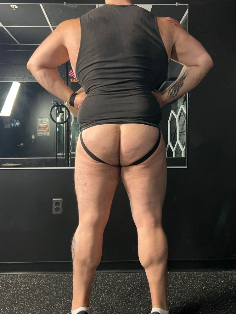 Me in a jock and cutoff flexing my calves