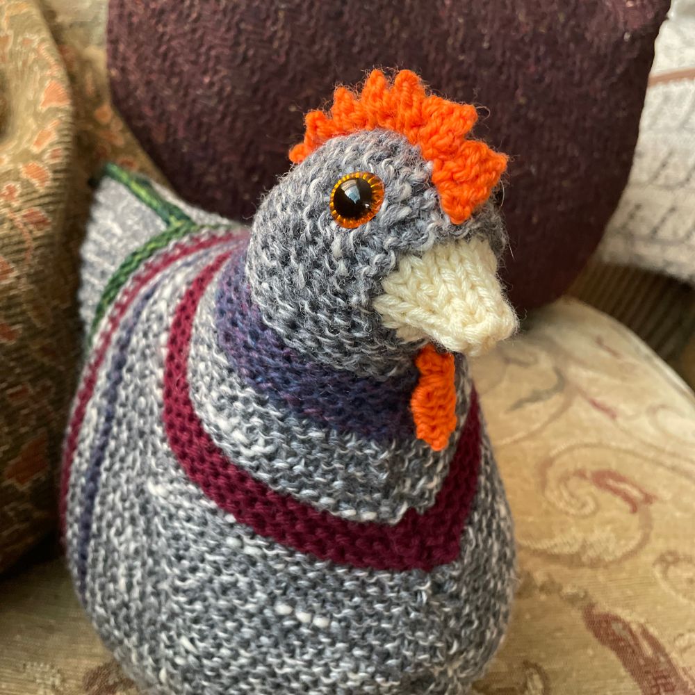 A knitted, stuffed chicken