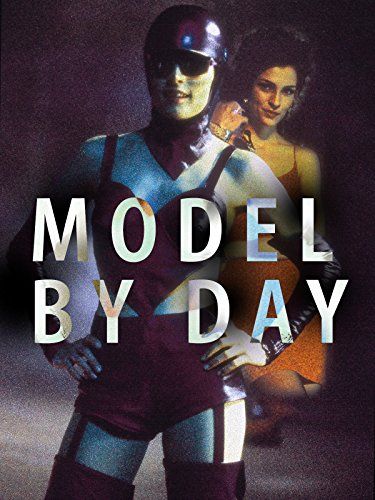 Promo thumbnail for the 1994 TV movie Model By Day. Famke Janssen poses with hands on hips wearing a small purple costume with stockings and suspenders, and a shiny purple helmet with sunglasses.