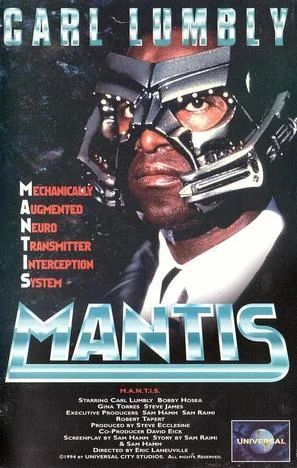 VHS cover for the film MANTIS, the pilot movie for the TV show of the same name produced by Sam Raimi and written by Sam Hamm, who also wrote the '89 Batman. Carl Lumbly is seen on the cover wearing a metal mask which covers most of his face. The tagline identifies MANTIS as an acronym for Mechanically Augmented Neuro Transmitter Interception System.