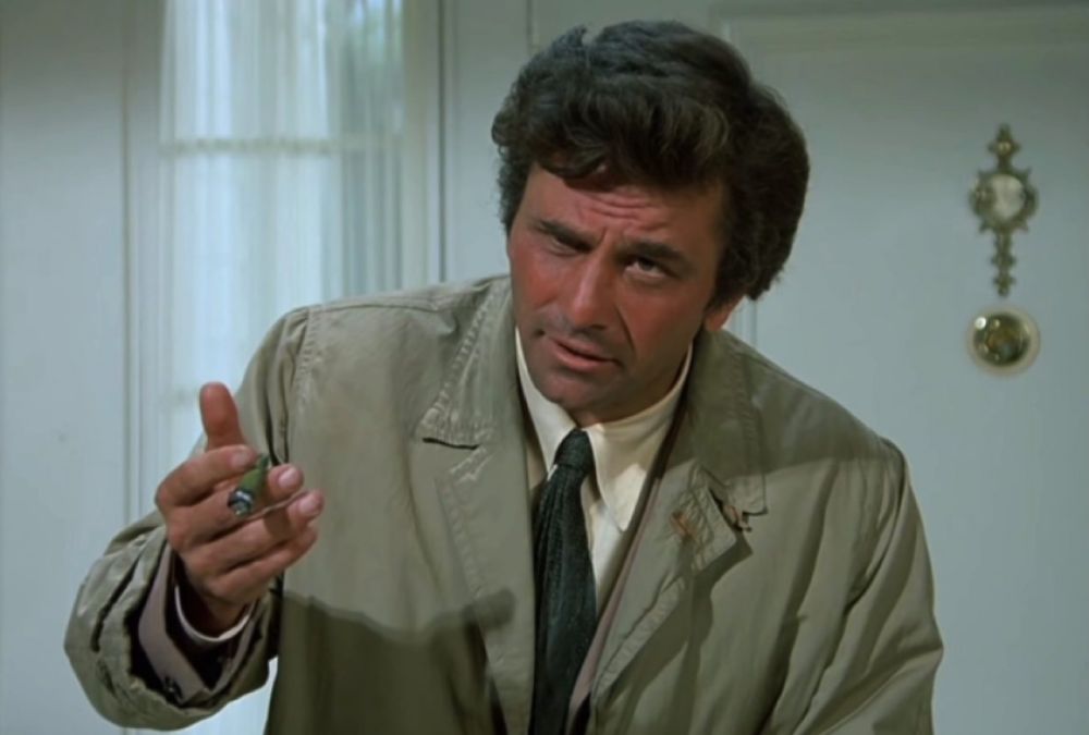 Peter Falk as Columbo, looking quizzically at someone off camera.