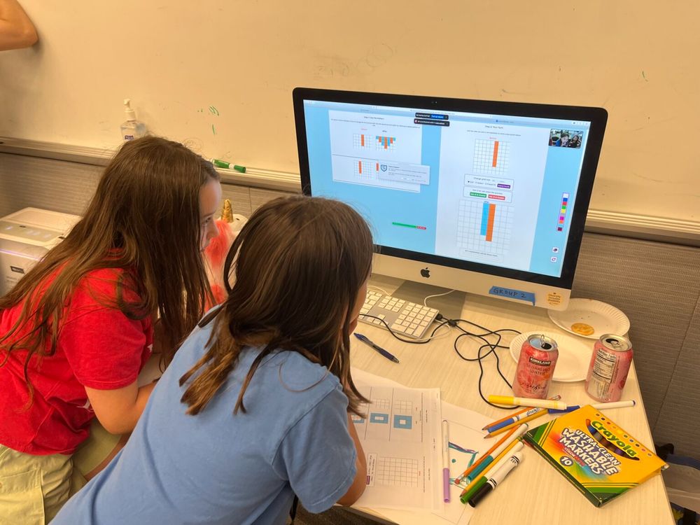 Kids play a game on the computer