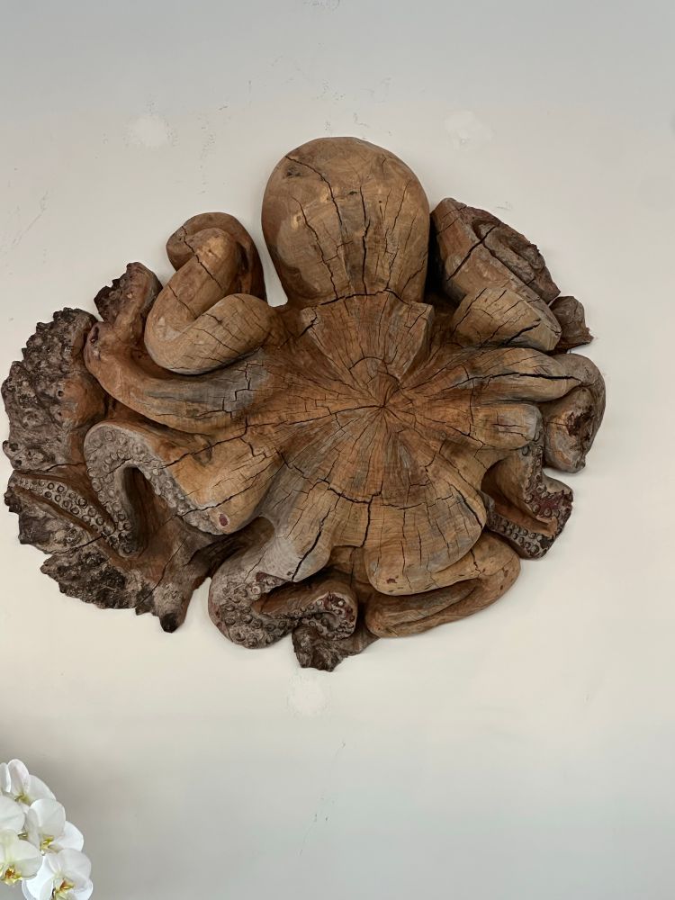 A large octopus carved from driftwood. 