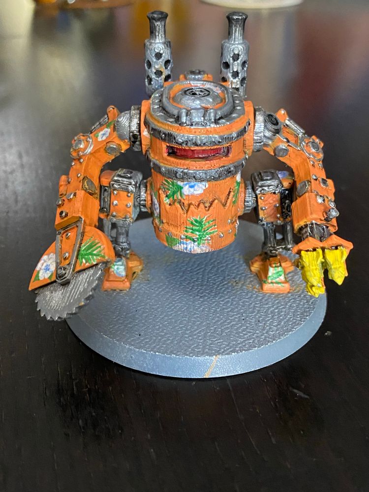 An orange and flowers Hawaiian print pattern Ork Killer Kan from Warhammer 40k