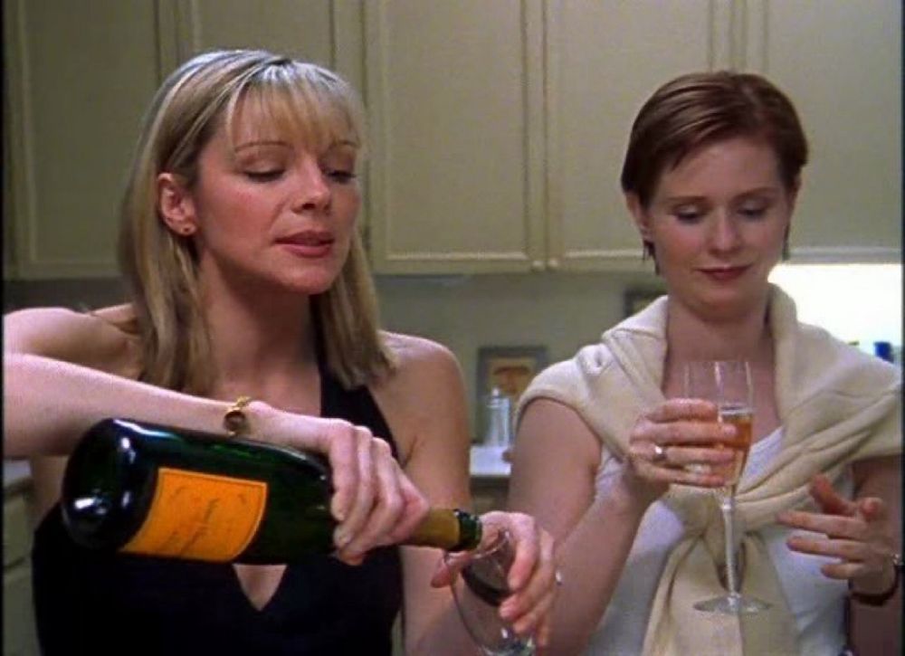 Two white ladies with fuck ass bobs, pour glasses of wine