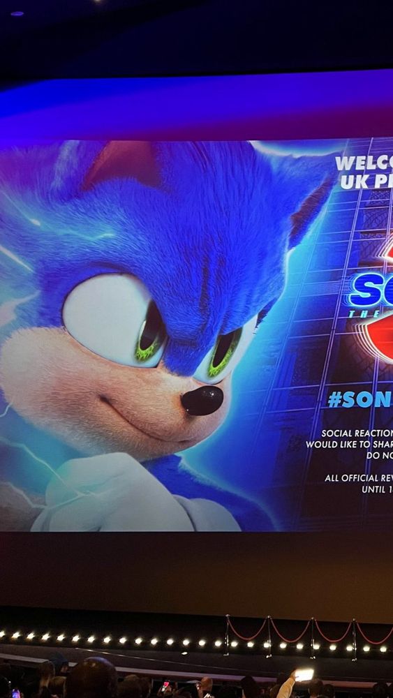 Photo of Sonic's half of the projected announcement before the movie began. He runs towards Shadow with a smile.
