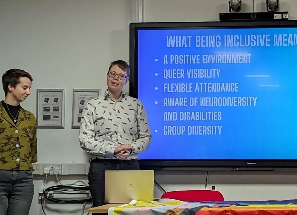 Person stood giving a presentation on inclusivity