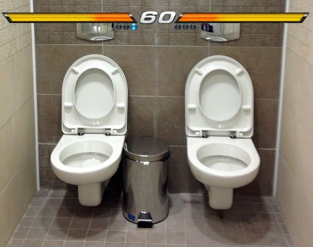 A photo of two toilets side-by-side within a single stall, only a trash can between them. Above the toilets is a fighting game overlay, with a healthbar for each toilet and the timer reading "60" in the middle of them.