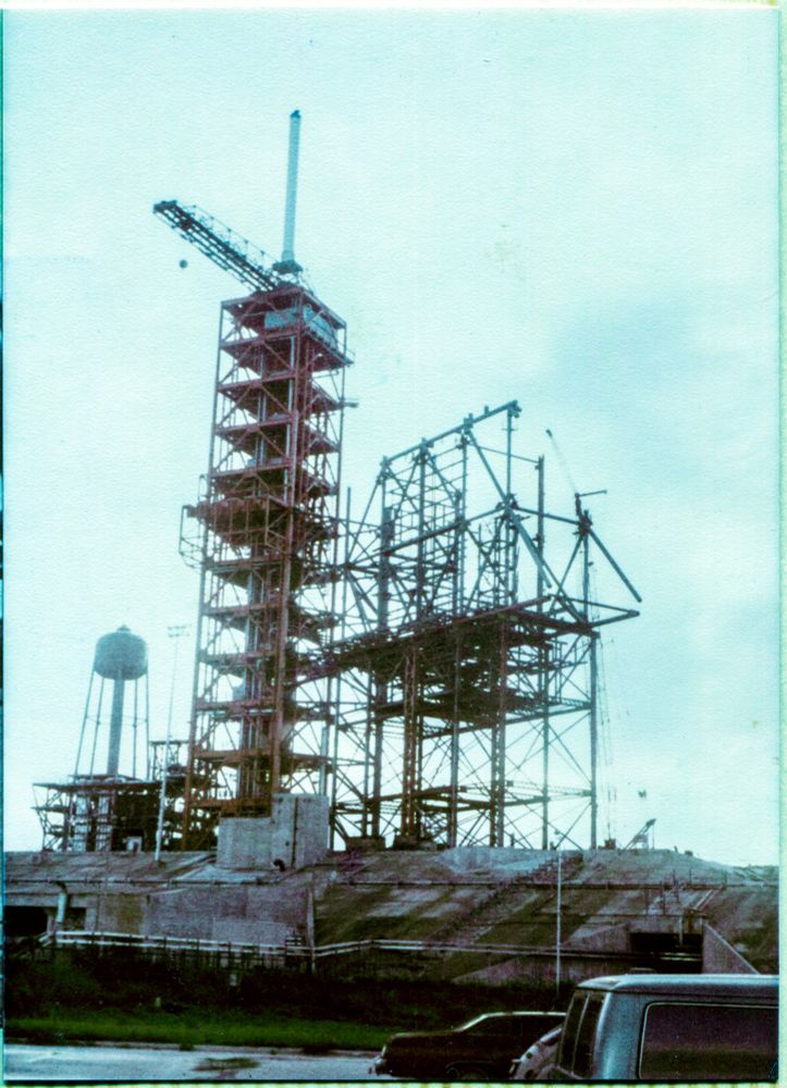 Skeletal RSS supported by its temporary falsework, next to the completed FSS in 1980. when Pad 39-B was being modified from Apollo Saturn V to Space Shuttle.

First photo I ever took of it.

NASA seems to have taken none.

Steel fabricated by Sheffield Steel, and erected by Wilhoit.

https://www.16streets.com/39-B/39-B%20Construction%20History%20-%20Space%20Shuttle%20-%20Contents.html