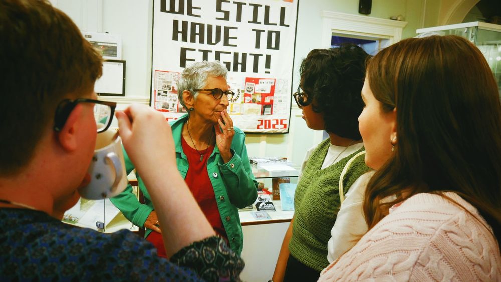 Poet Seni Seneviratne speaks to the Little Flames group.