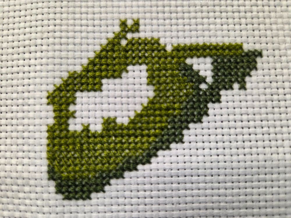 cross stitch in progress of Dragon and Castle