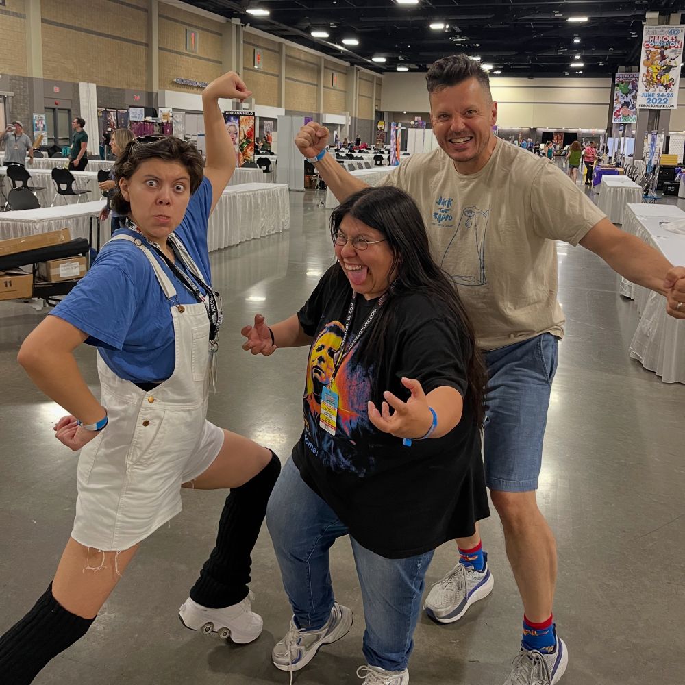 A photo of Maria Wolf with Tyler Chin-Tanner and Maddy Chin-Tanner at Heroes Con.