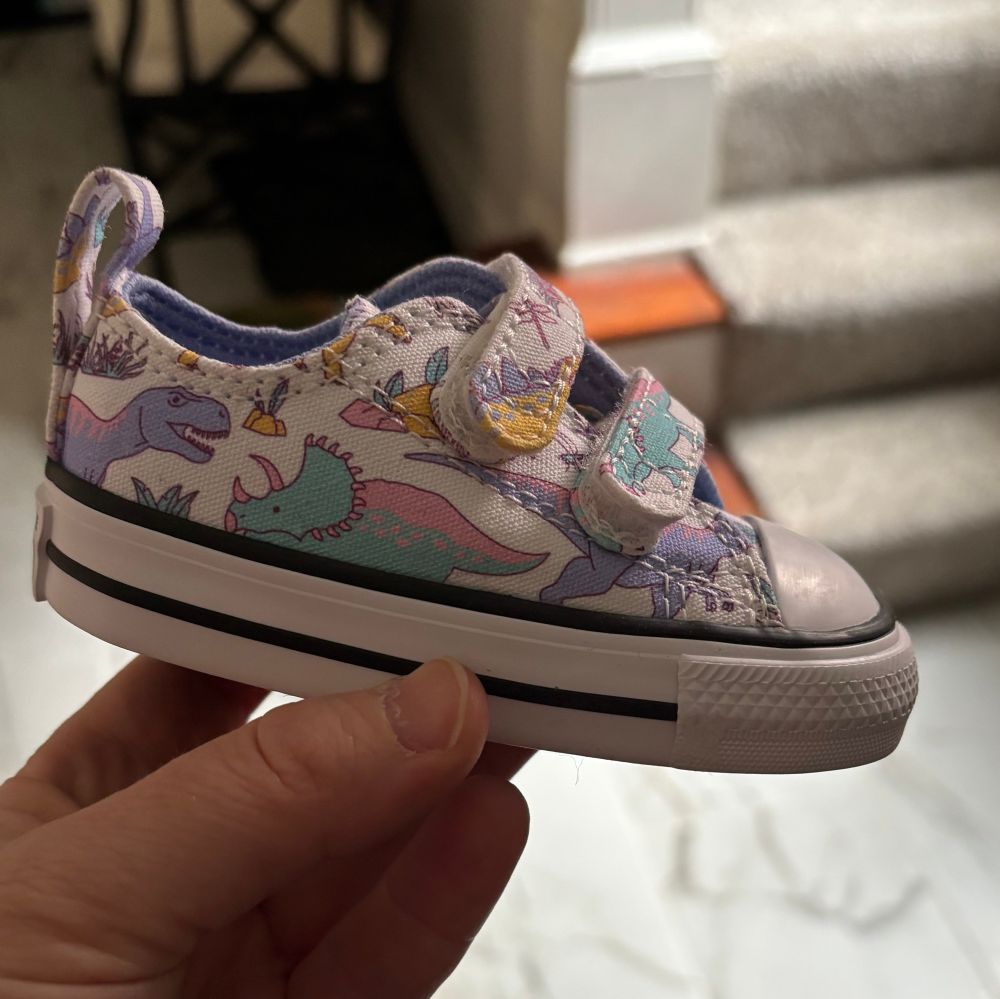 Converse low top sneaker size 3c with Velcro enclosures with pastel colored dinosaurs 