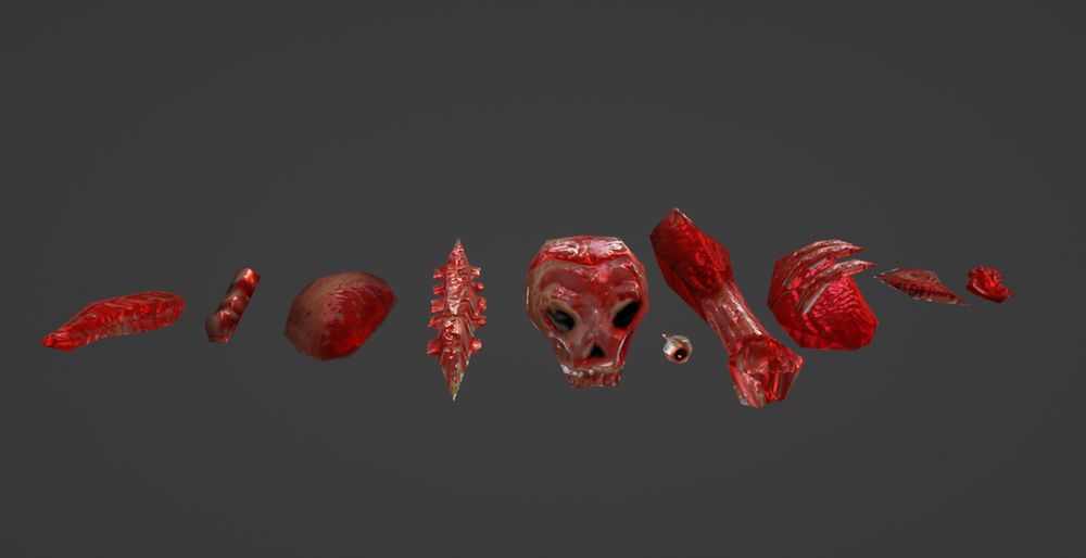 A series of gibs in a row: meat thing, a cord looking meat thing, an unidentified organ, a spinal column, a skull, an eyeball, a thigh, a lung and ribs, and two more meat things.