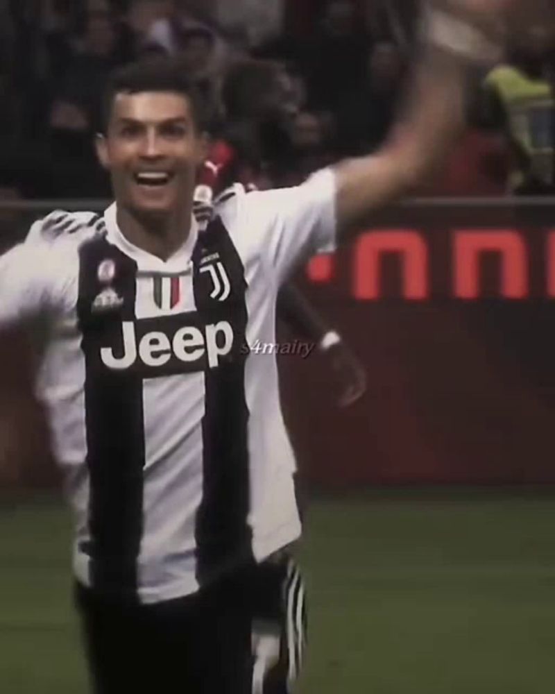 a soccer player wearing a jeep jersey is celebrating