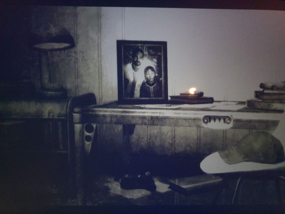 Photo of one of the ending slides in Fallout 3, with a framed picture of fem!Lone Wanderer as a child with her father.