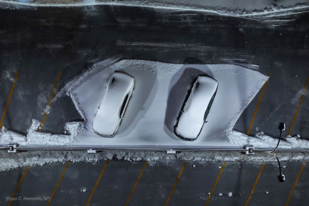 Snow covers vehicles parked at the Helix Garage in downtown Lexington, Ky., on Monday, Jan. 6, 2025. (Photo by Ryan C. Hermens for the AP)