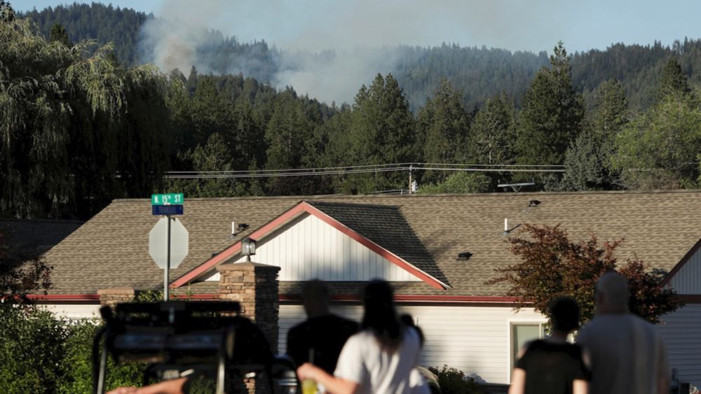 Gunman set blaze before fatal ambush on Idaho firefighters, police say