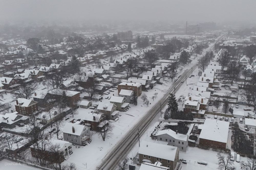 Snow covers homes during a winter storm, Monday, Jan. 6, 2025, in Cincinnati. (Photo by Joshua A. Bickel for the AP)