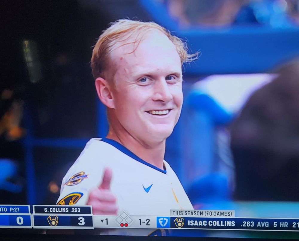 a photo of andrew vaughn, possibly the greatest hitter of all time, giving a thumbs up to the camera. he looks 60 or 70 years old despite being 27.