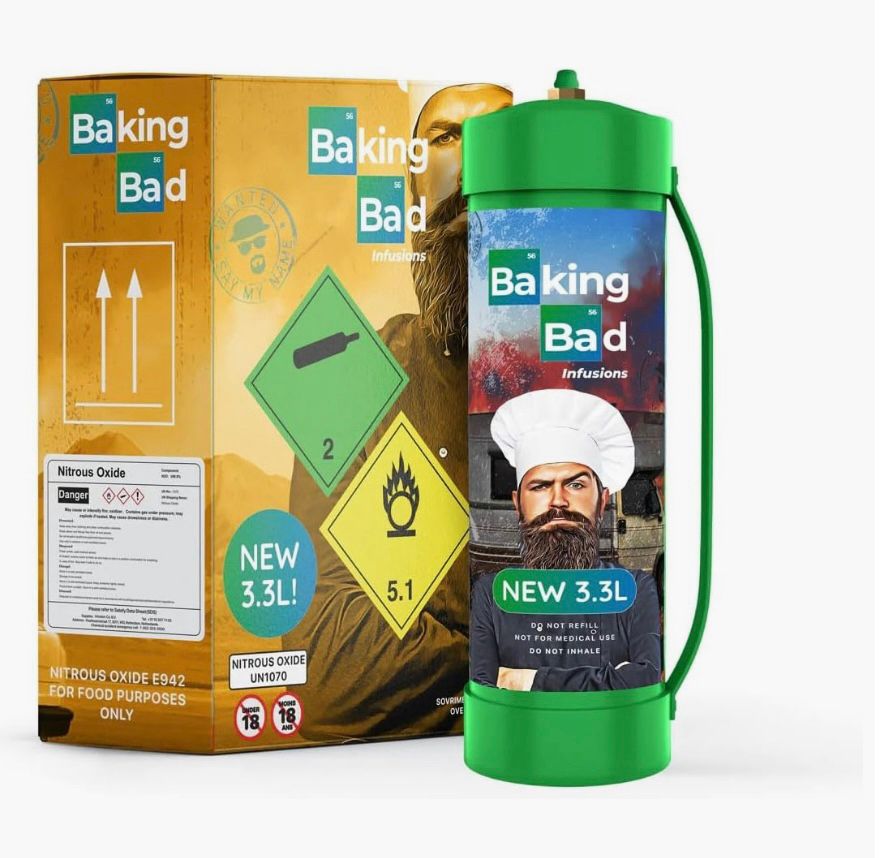 3.3L green canister of nitrous oxide branded “Baking Bad” with a picture of a bearded man in a chefs hat, with box in the background with hazmat warnings