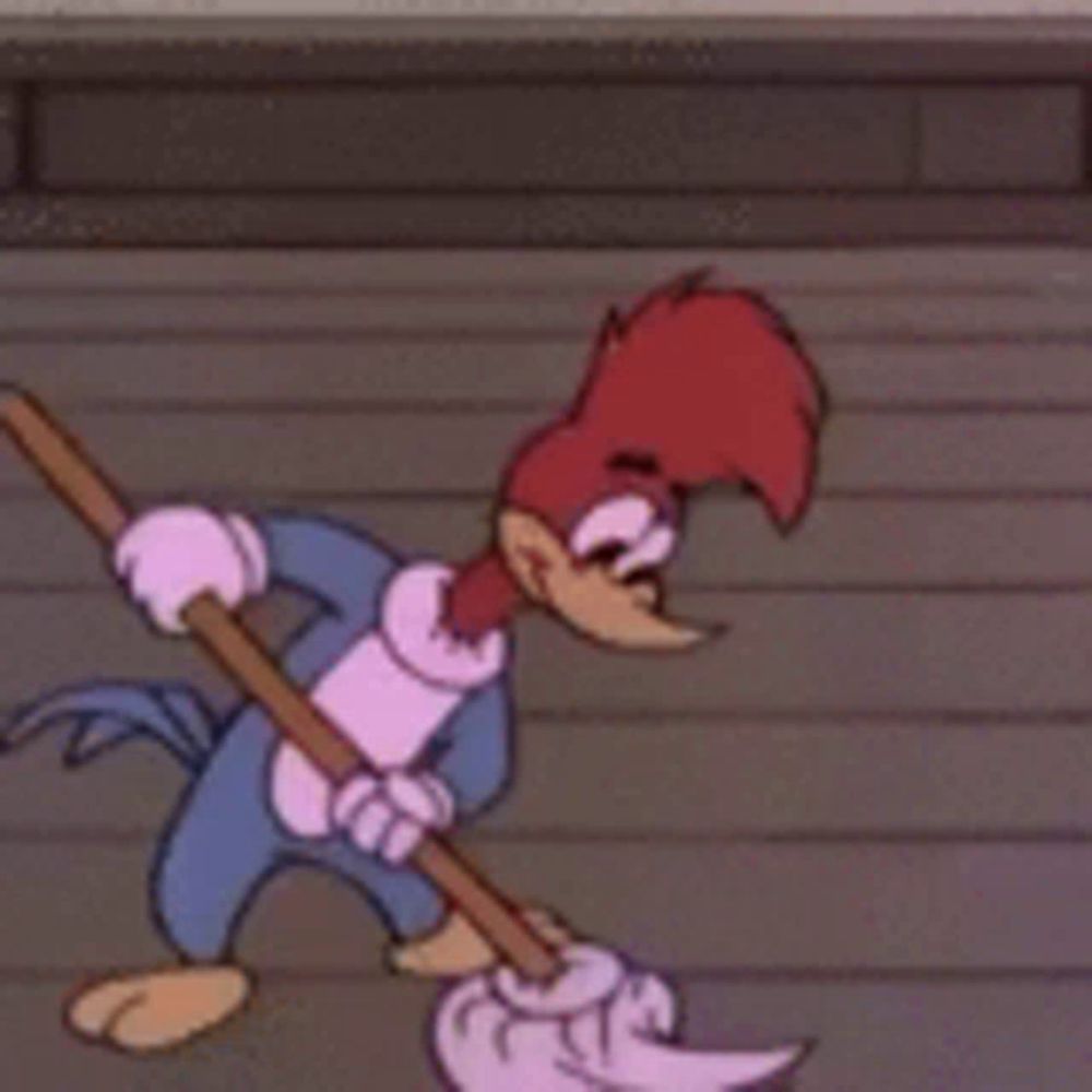 woody woodpecker is mopping the floor with a mop and a towel .