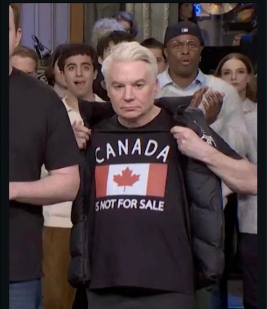 Mike Myers on Saturday Night Live showing a t shirt that says Canada is not for sale 