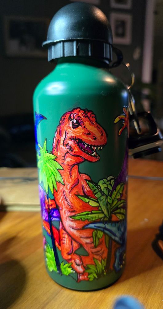 Colored orange t rex on the dinosaur drink bottle