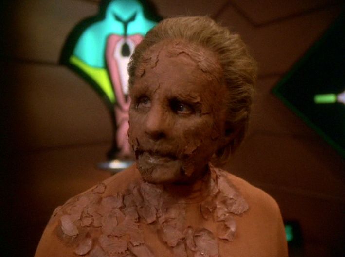 The females Changeling on Star Trek: Deep Space Nine after the great link was infected with the morphogenetic virus by Section 31/Sarfleet. Her solid form appears to be breaking down and her exterior (skin, clothes, etc. since it’s all actually her solidified)