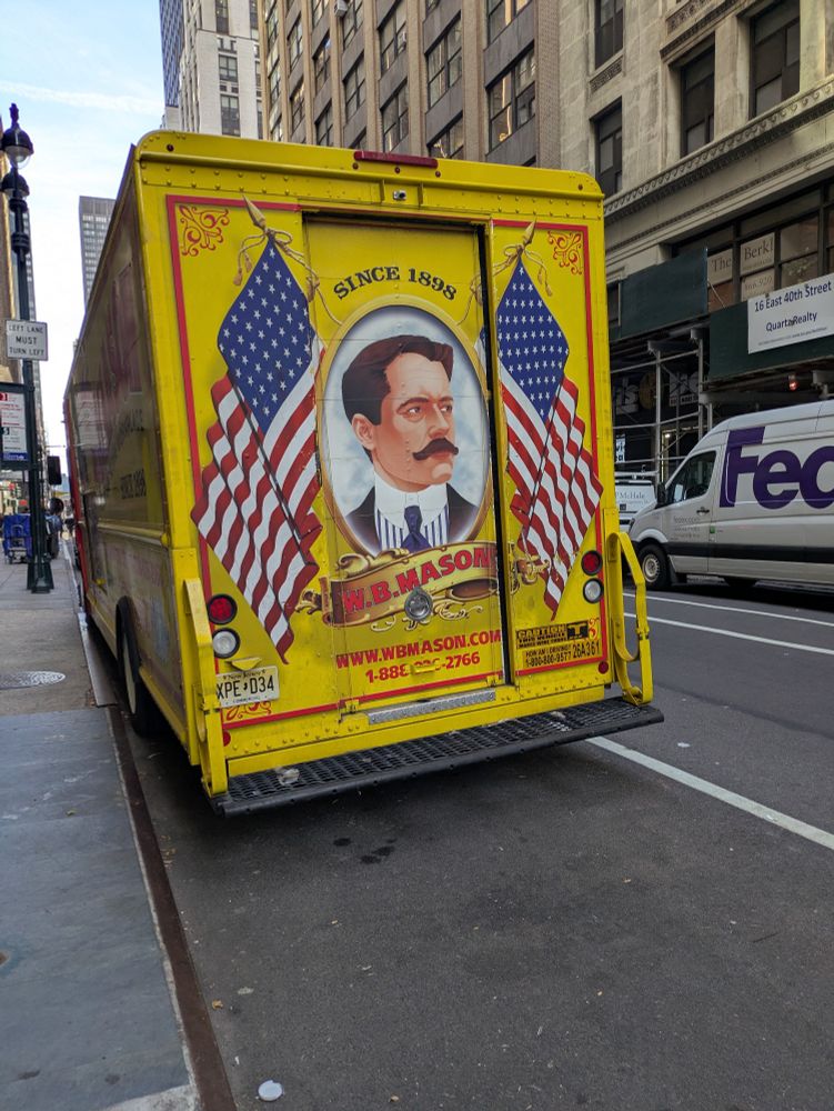 A w.b. Mason office supply truck with the portrait of its founder that looks like Kyle MacLachlan. 