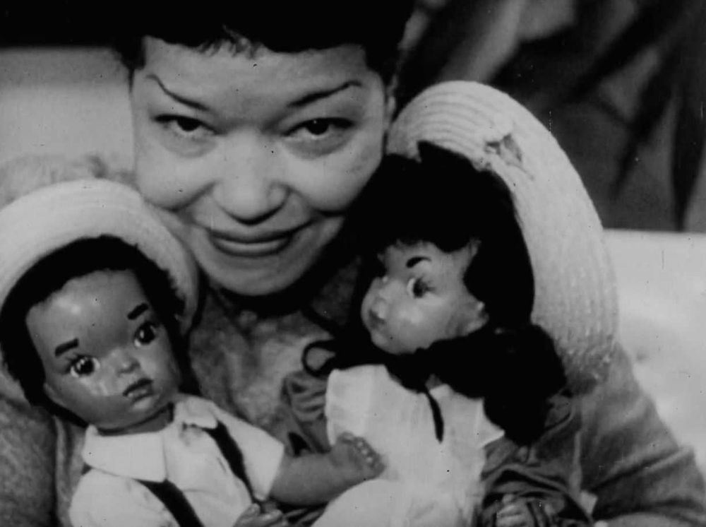 A photo of her with Patty Jo and Benji dolls
