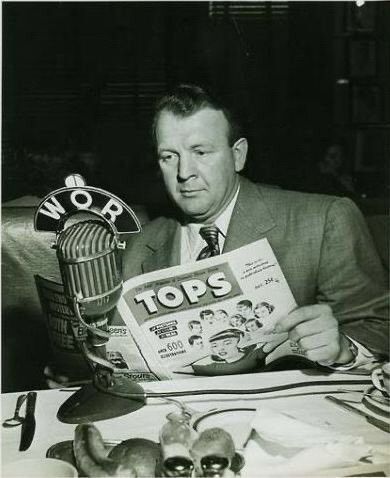 A photo of Biro reading an issue of Tops magazine.
