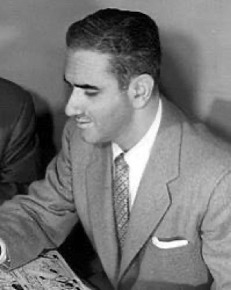 A black and white photo of Oksner.