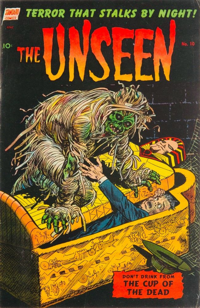 The Unseen #10 (1953). On the cover, a mummy is burying a man in a sarcophagus, and sitting on the lid as the man tries to reach out in vain, and the mummy’s bandage is unraveling, revealing his green, decomposed body underneath.