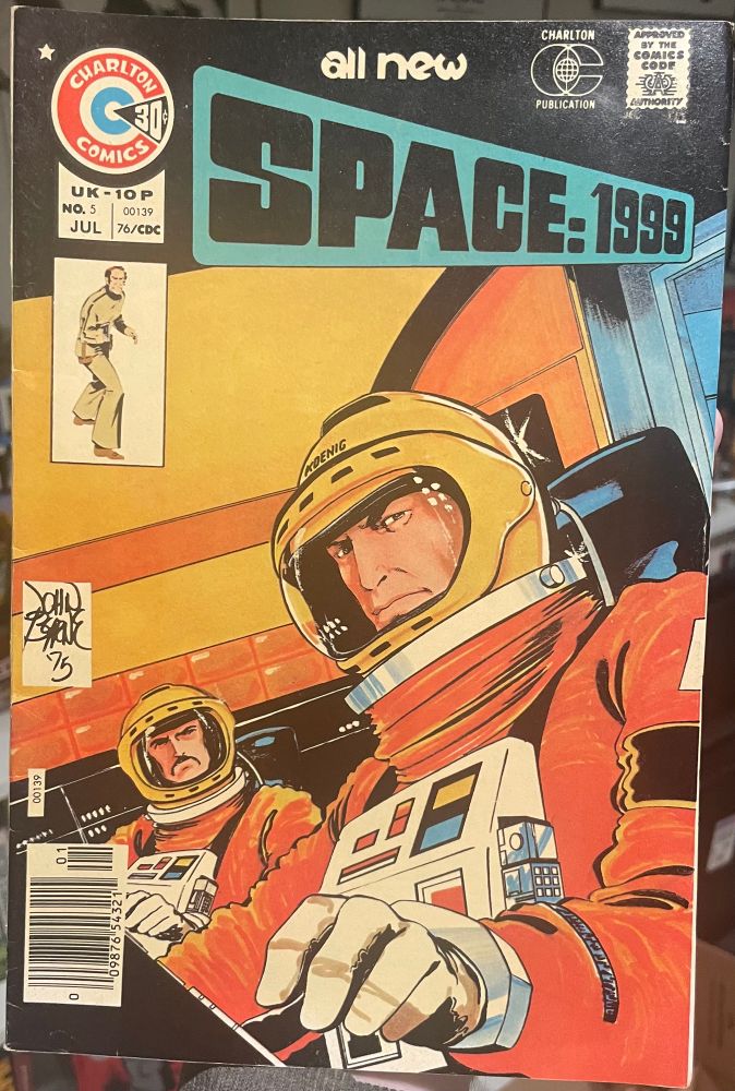 Space 1999 #5 (1976). The cover shows John Koenig & Paul Morrow (?) in space suits piloting a ship. Art by John Byrne.
