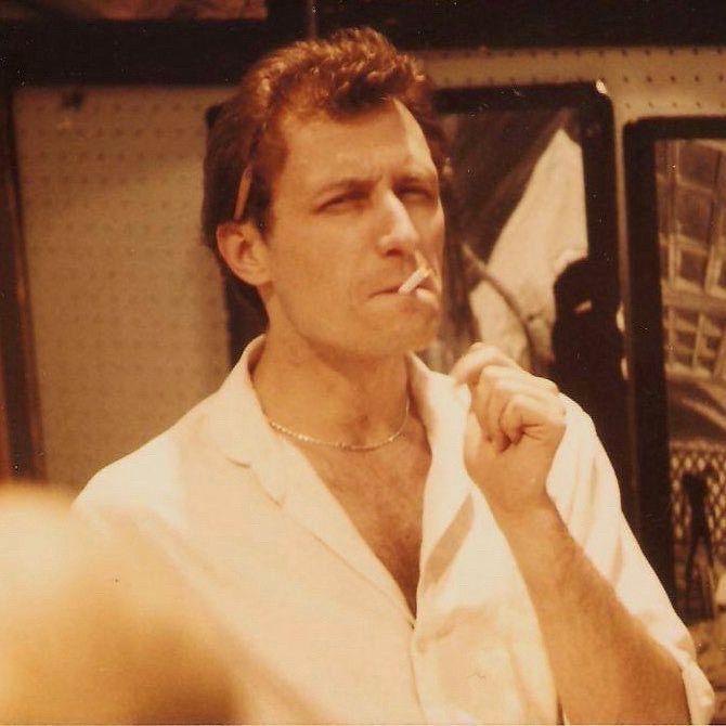 A photo of Rogers smoking a cigarette.