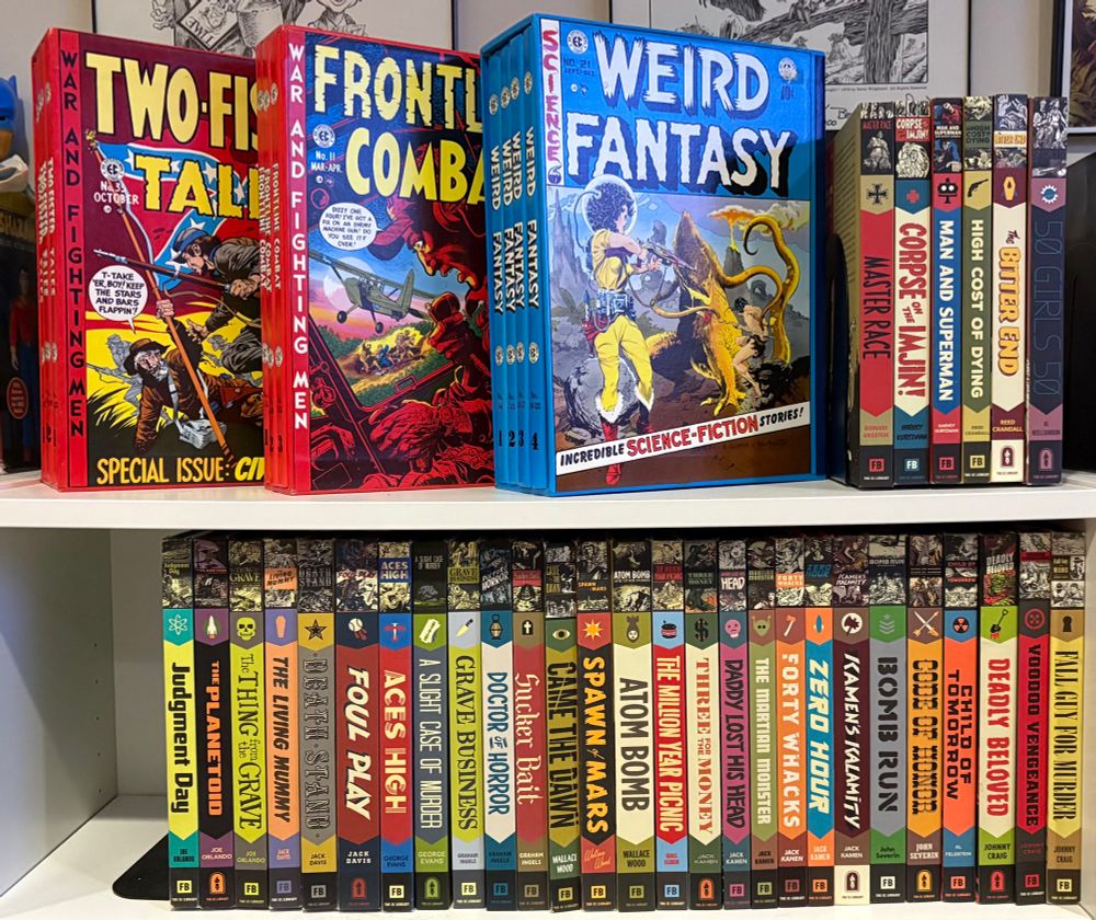 The top shelf has slipcase editions of Two-Fisted Tales, Frontline Combat, and Weird Fantasy, plus six of the Artist's Library books. The second shelf has the rest of my Artist's Library books.