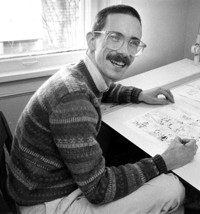 A photo of Watterson at his drawing table.