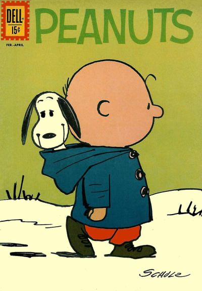 Peanuts #12 (1962). The cover by Dale Hale shows Charlie Brown walking in the snow. He is wearing coat but not the hood, which is hanging in his back. We can see that Snoopy is sitting in the hood, smiling.