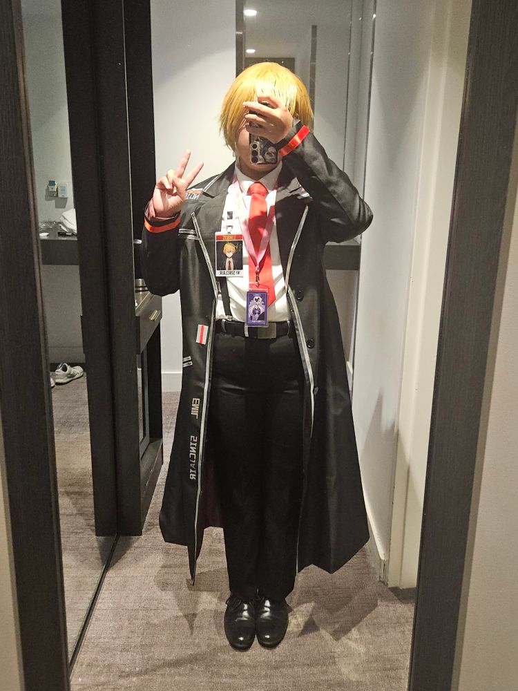 A mirror selfie of me in cosplay, as Sinclair from Limbus company. I am holding up a peace sign. The phone is positioned in a way that obscures my face.