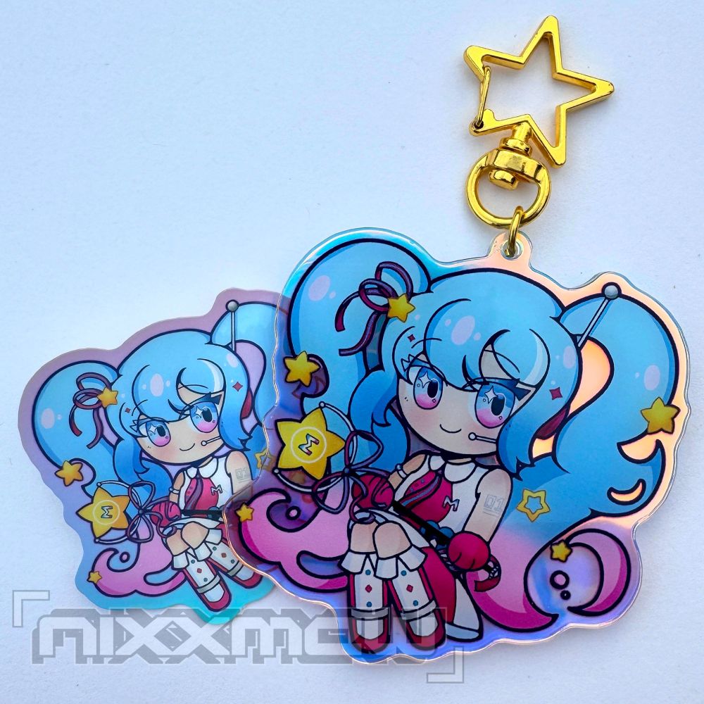 A sticker and keychain with a chibi design of Hatsune Miku, in her outfit from Future Eve - sasakure.uk. The keychain has a gold, star shaped clasp.