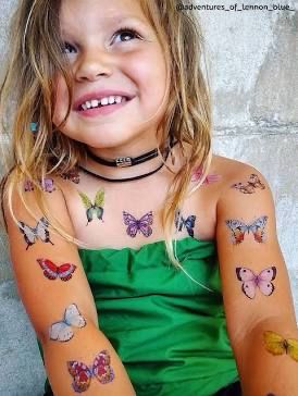 Little girl with butterfly tats