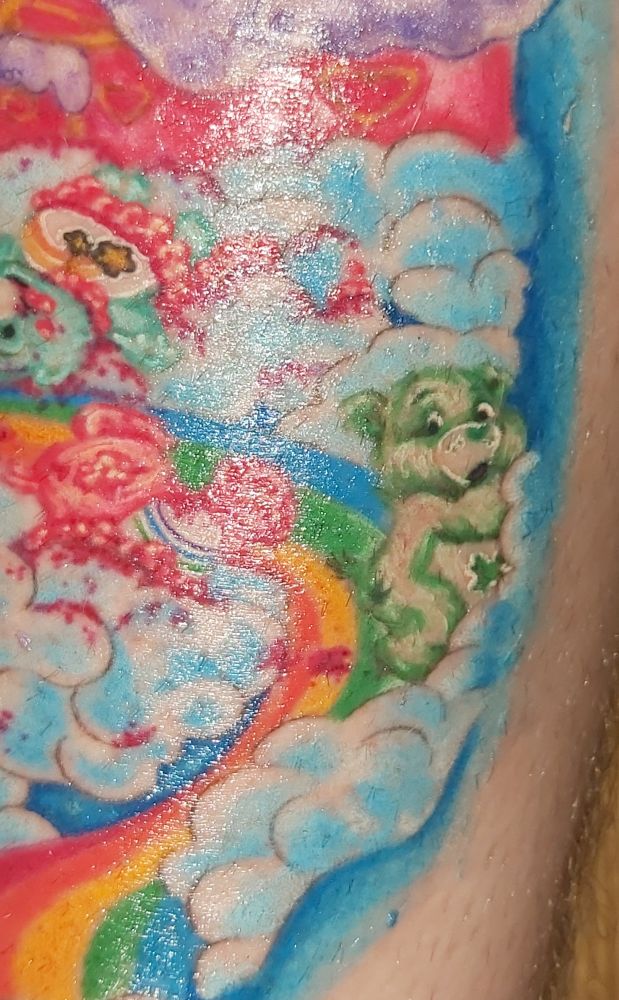 A shot better showing Good Luck Bear, the only escapee... escaping, because he was lucky. A mangled Cheer Bear and Wish Bear lay in various stages of disembowelment in the background.