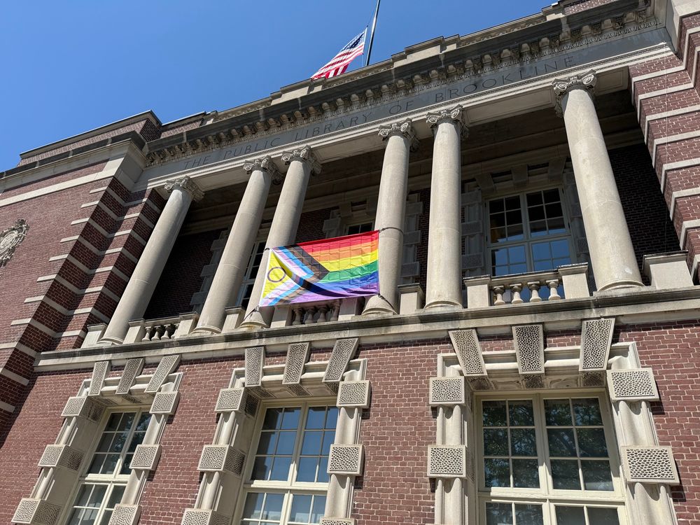 Pride flag on display outside the Brookline village branch of the Brookline Public Library 