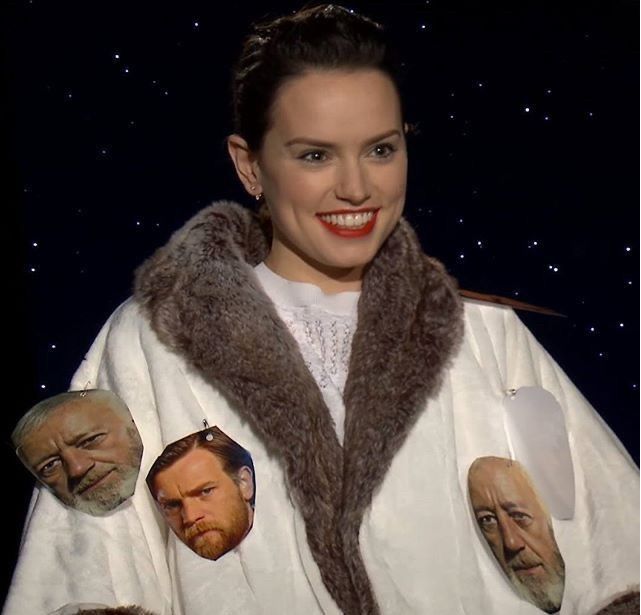 Daisy Ridley, adorable, smiling, apparently in Star Wars promo wearing a fur-lined coat with pictures of obi-wan kenobi safety pinned to it for some reason??????
